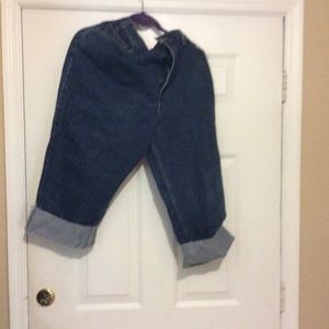 Levi’s jeans have been cut off from mid-shin.